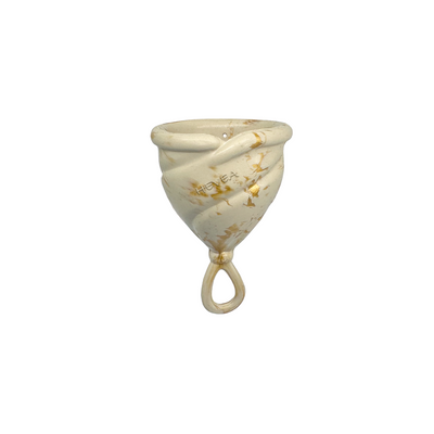 Underprotection menstrual cup in light green made of 100% natural rubber